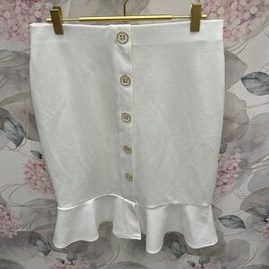 ADORABLE and CLASSY white skirt with buttons and ruffles at the bottom!!